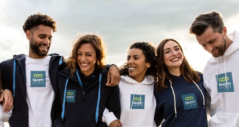 Group of friends wearing custom printed tshirts and hoodies from TeamShirts
