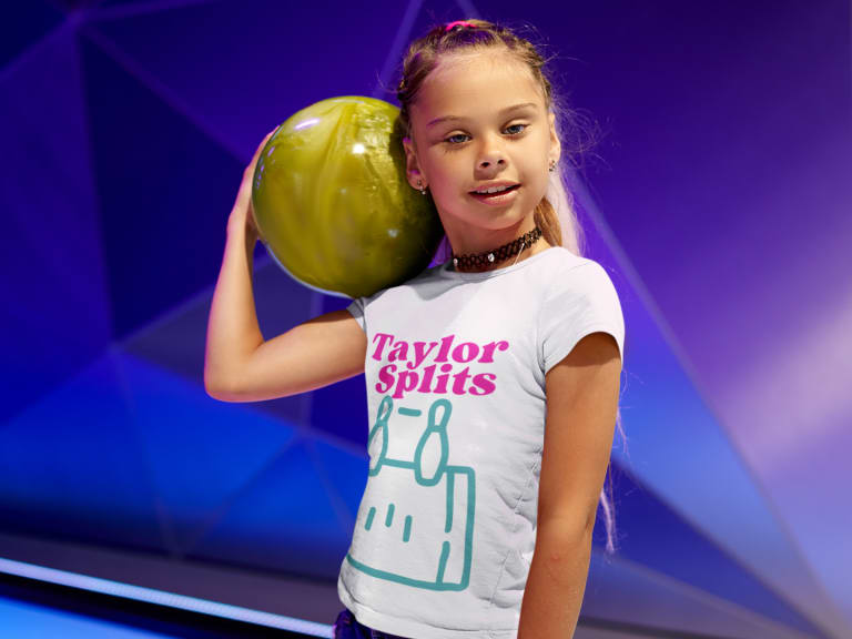 girl holding bowling ball