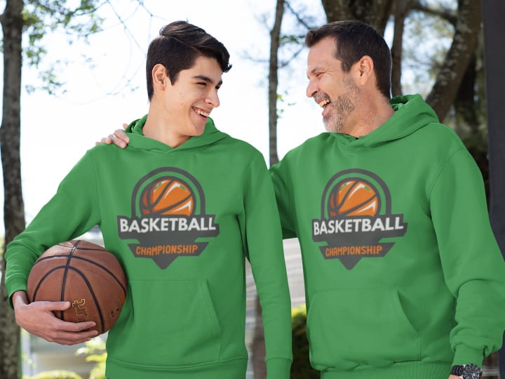 Two men wearing custom hoodies at basketball court