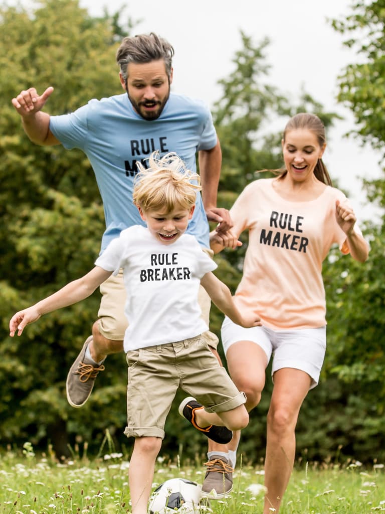 family playing in matching custom tshirts