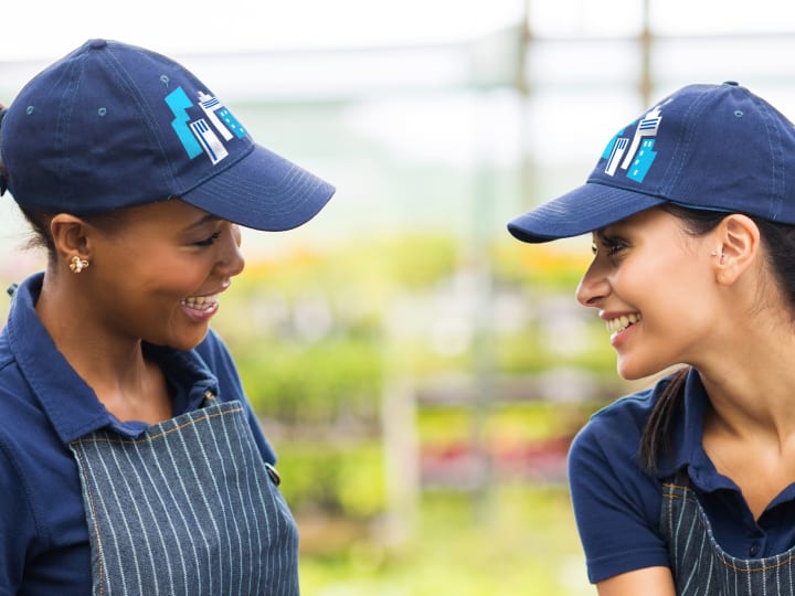 florist wearing matching custom hats with small busniess logo