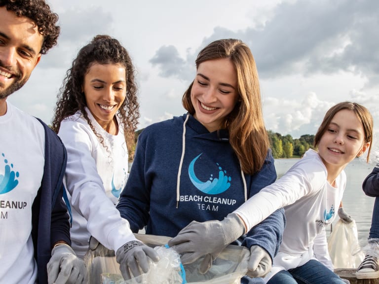 volunteers wearing tshirts for charity, nonprofit,beach cleanup