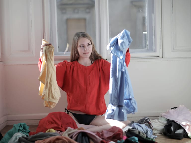 t-shirts washing, woman sorts laundry