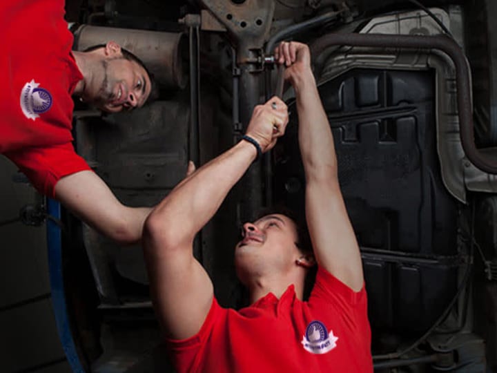 mechanics wearing matching custom tshirts with logo