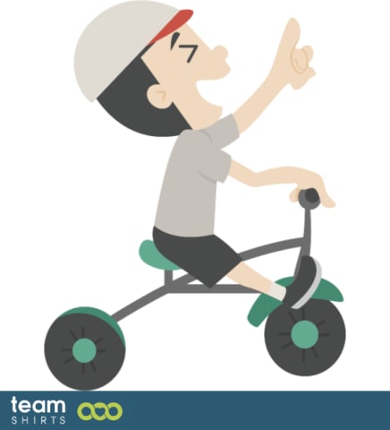 kid riding a tricycle