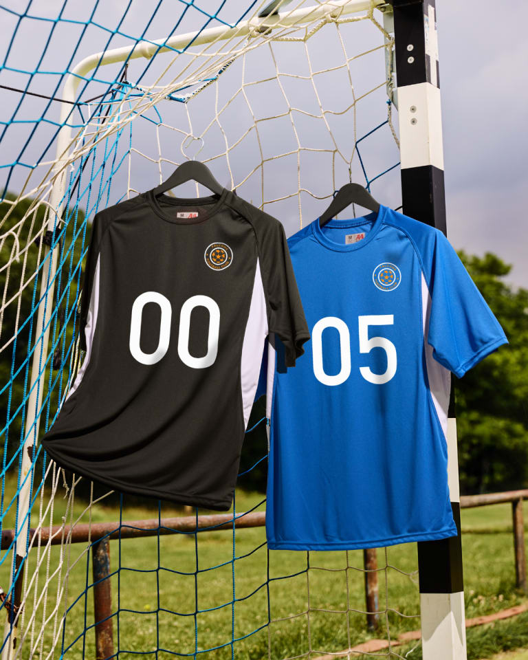 custom printed Soccer Jerseys hung up on soccer goal