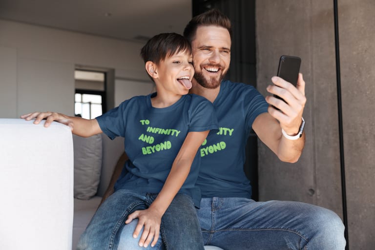 dad and son wearing matching disney vacation t shirts