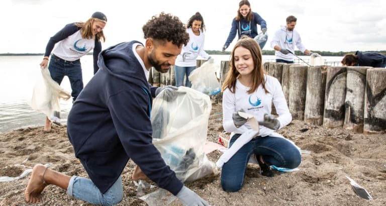 volunteers cleaning beach