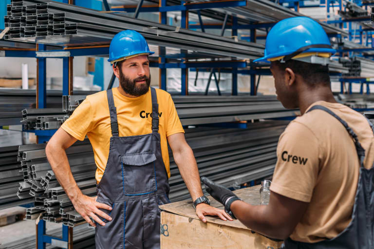 two men working in a steel factory